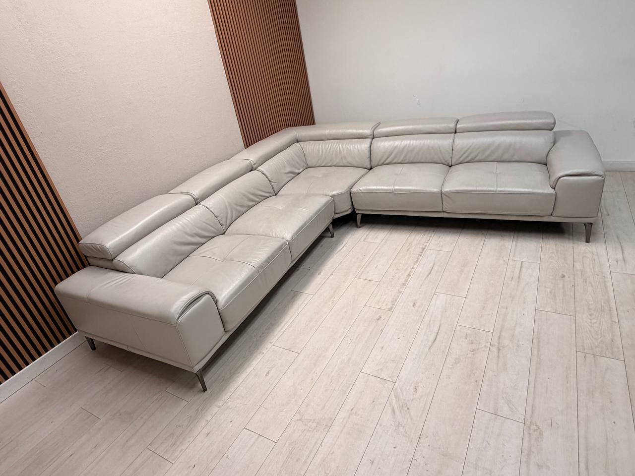 Abbyson Quinton gray top-grain leather sectional with adjustable headrests in living room