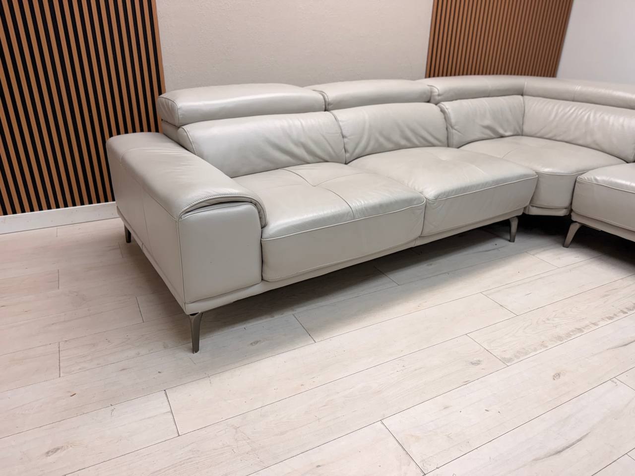 Abbyson Quinton gray top-grain leather sectional with adjustable headrests in living room