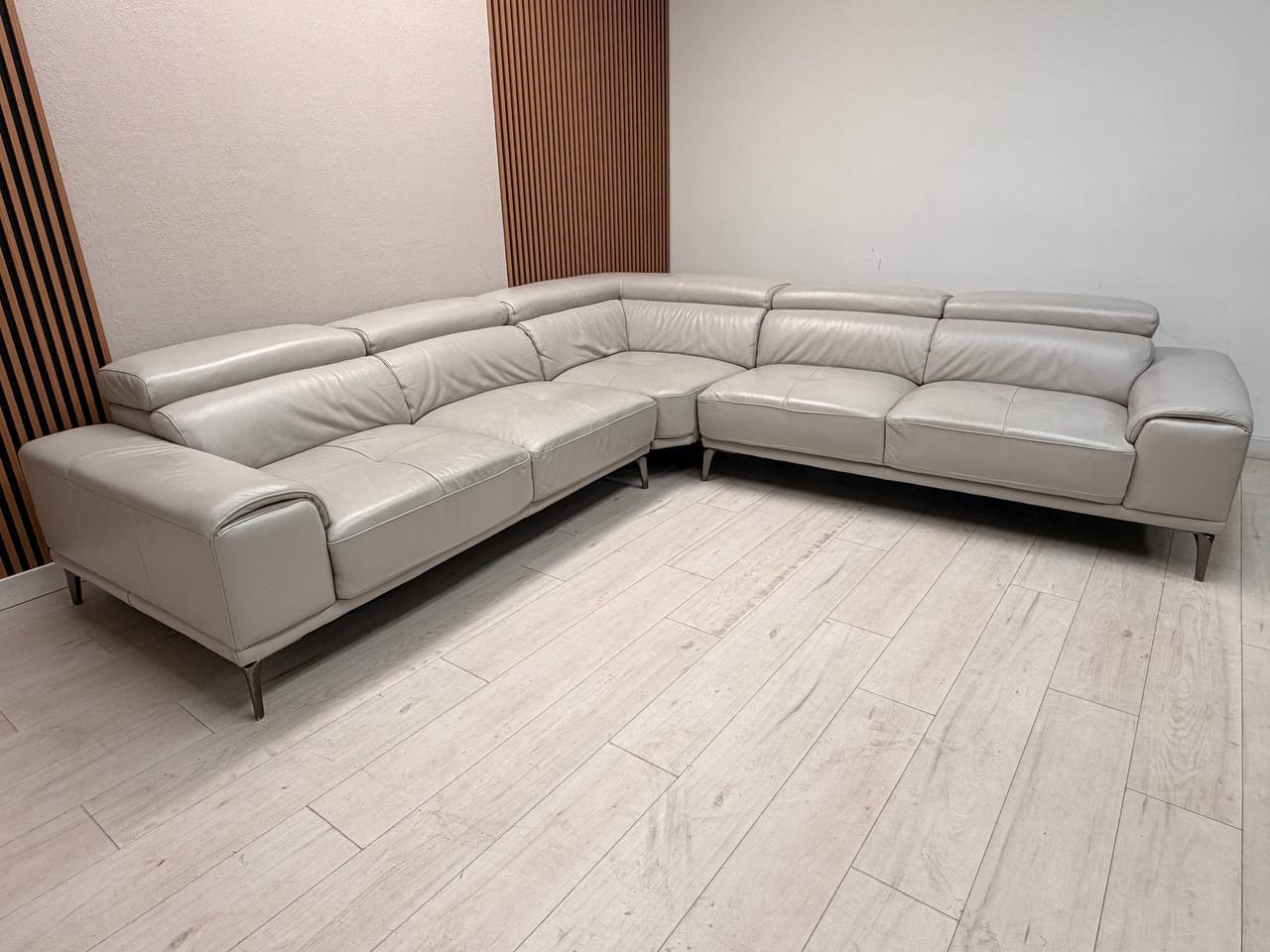 Abbyson Quinton gray top-grain leather sectional with adjustable headrests in living room