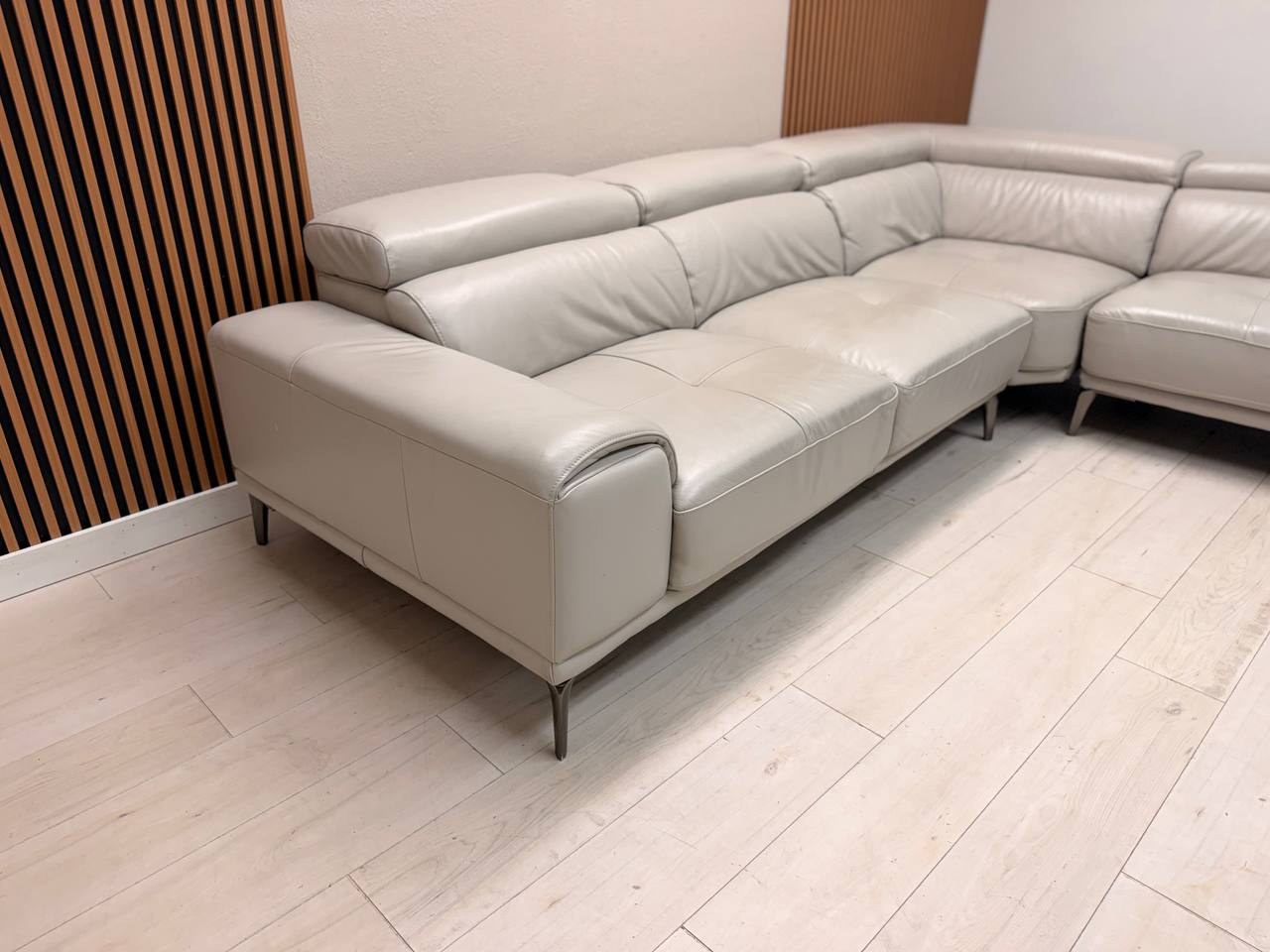 Abbyson Quinton gray top-grain leather sectional with adjustable headrests in living room