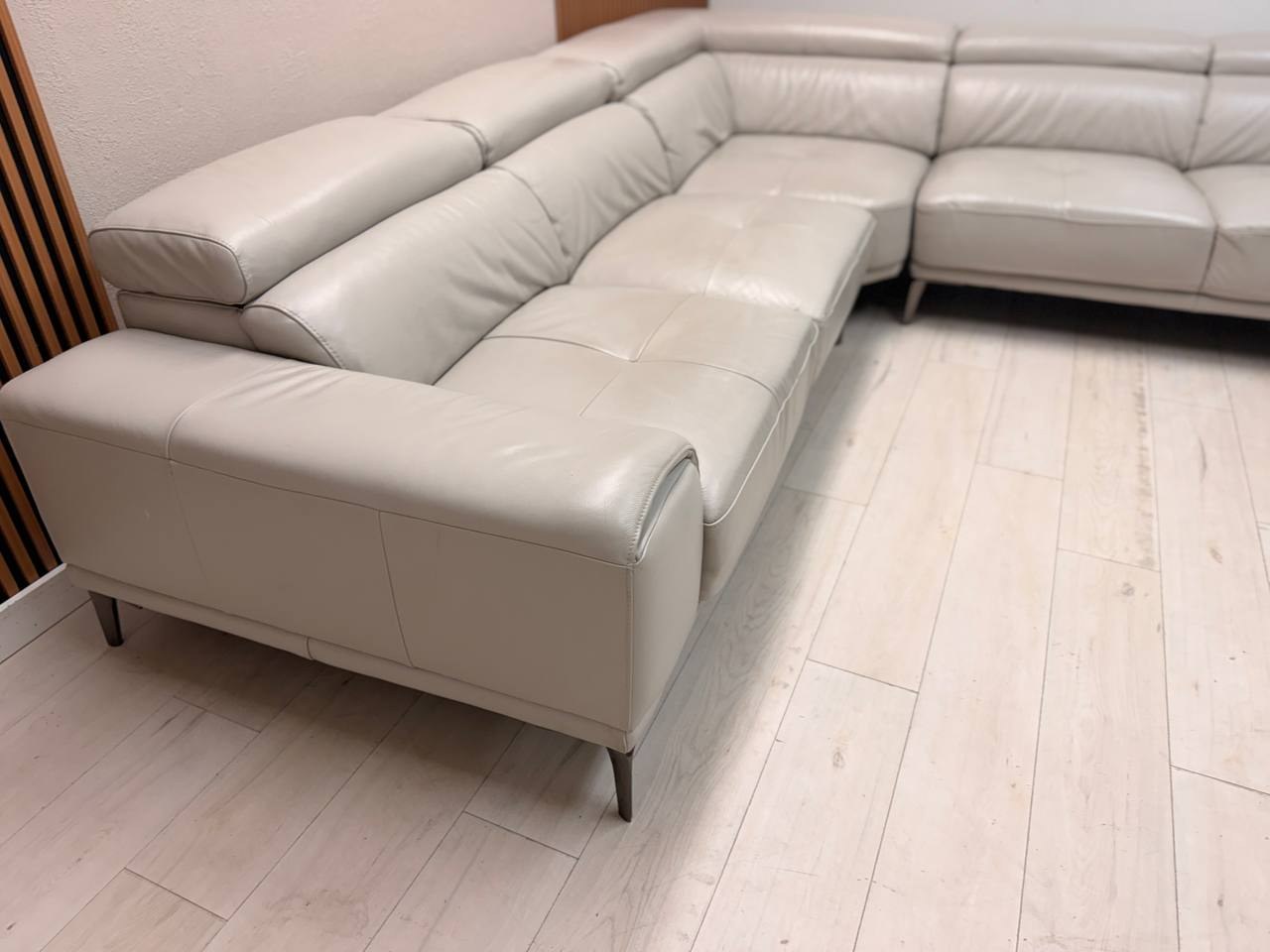 Abbyson Quinton gray top-grain leather sectional with adjustable headrests in living room