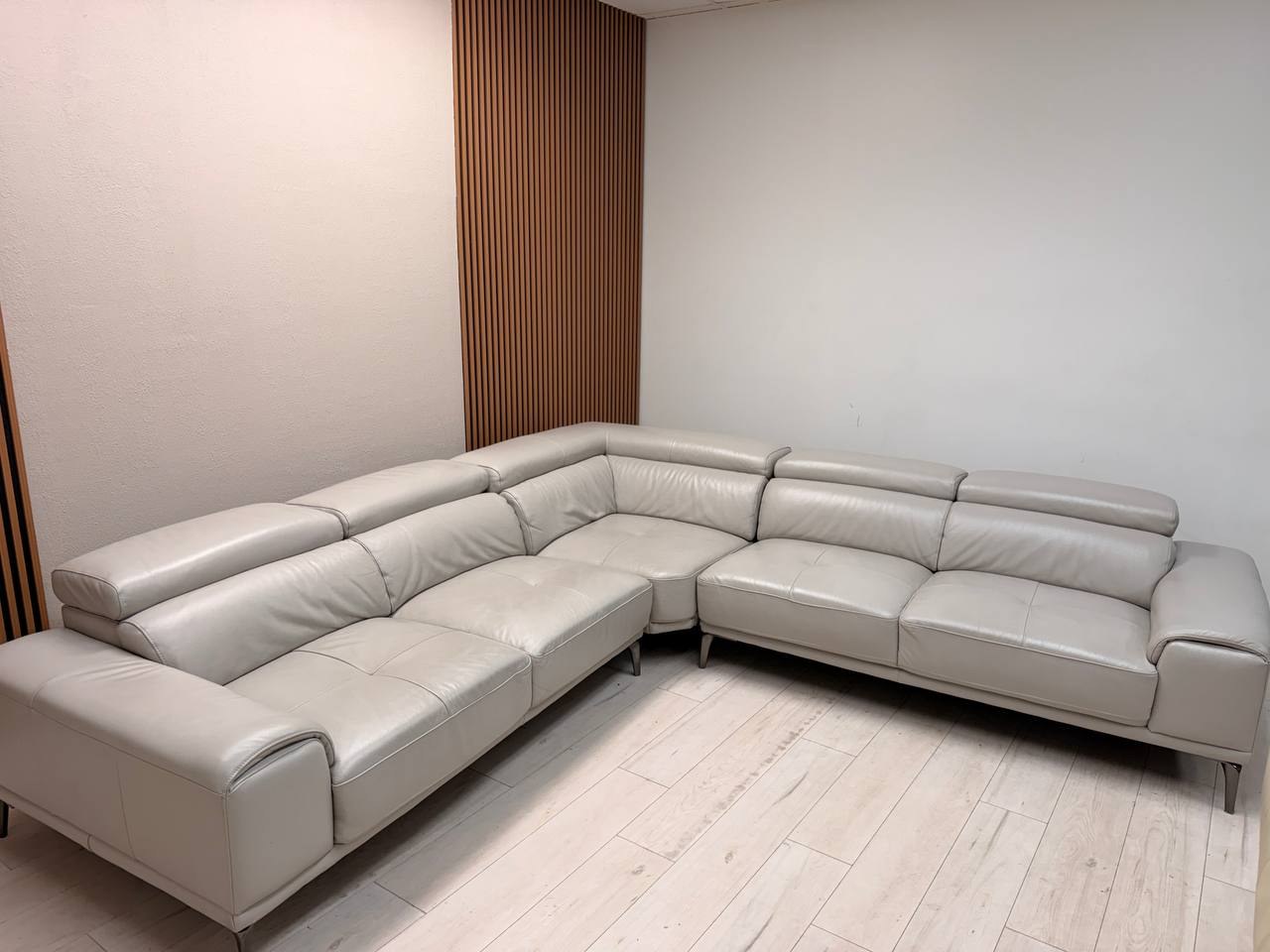 Abbyson Quinton gray top-grain leather sectional with adjustable headrests in living room