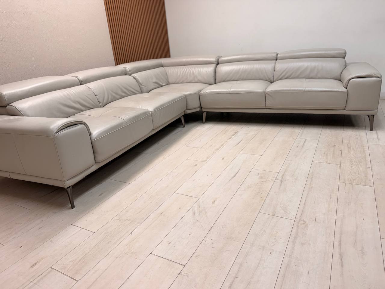 Abbyson Quinton gray top-grain leather sectional with adjustable headrests in living room