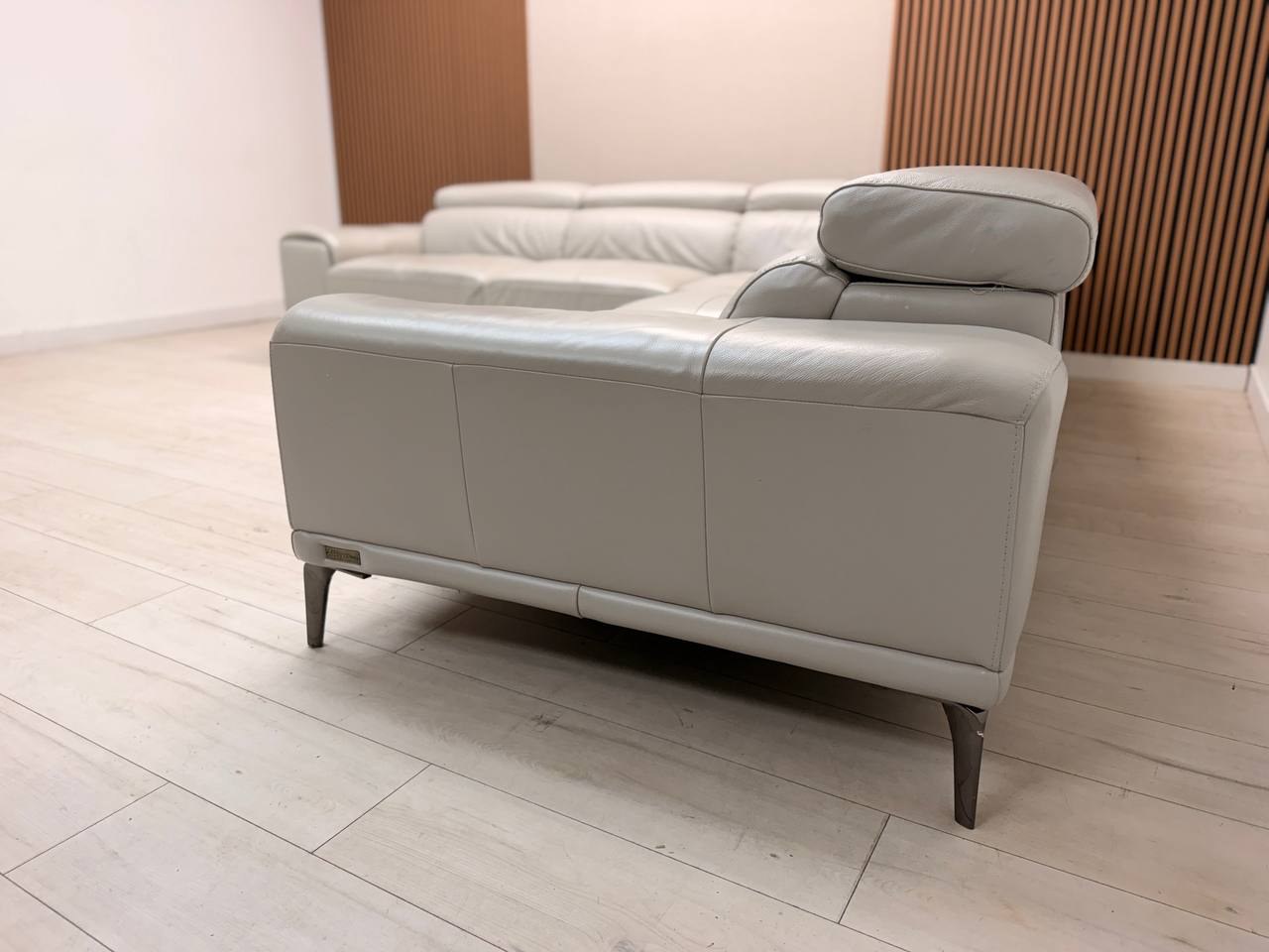 Abbyson Quinton gray top-grain leather sectional with adjustable headrests in living room
