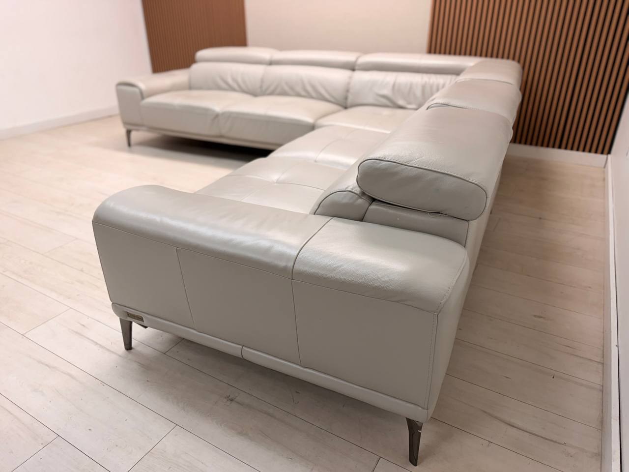 Abbyson Quinton gray top-grain leather sectional with adjustable headrests in living room